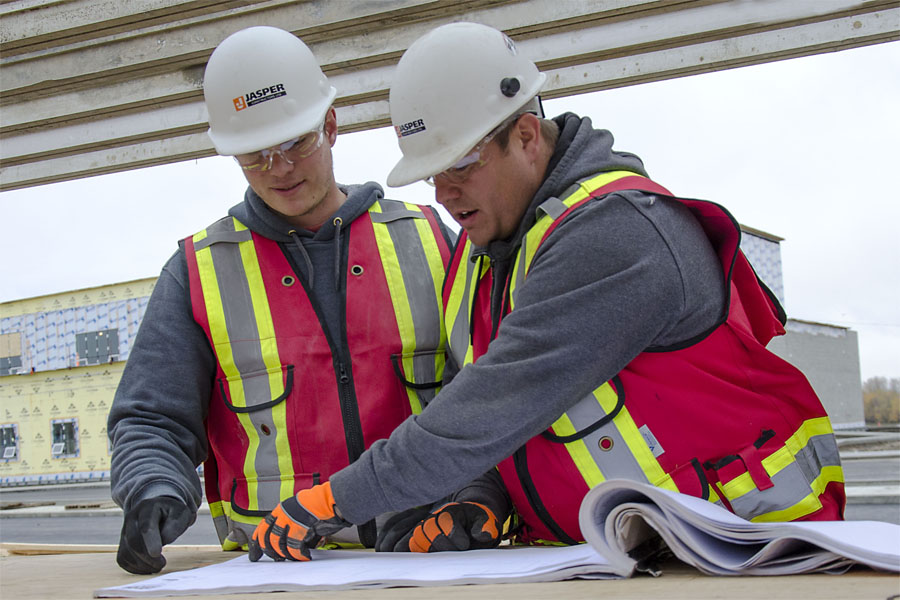 workers going over blueprints